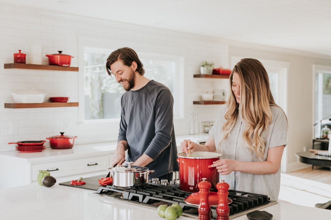 man-and-woman-on-kitchen-o7sk3d3tpwq