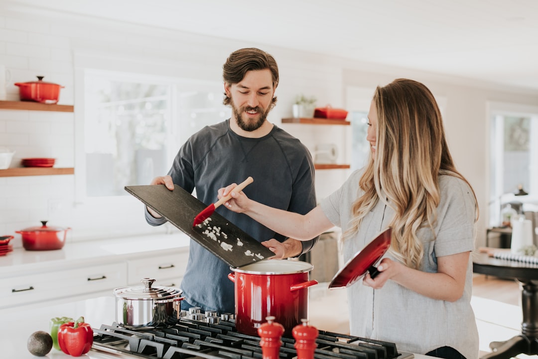 man-assisting-cooking-woman-kyh-o1jk7ee